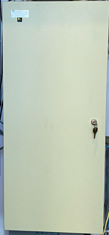Unity Systems Home Manager control enclosure in a residential equipment area
